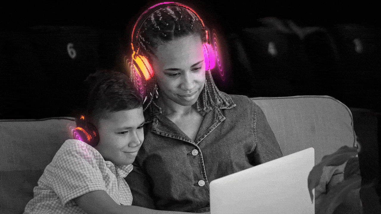 Girl and a boy is watching a movie while wearing a headset