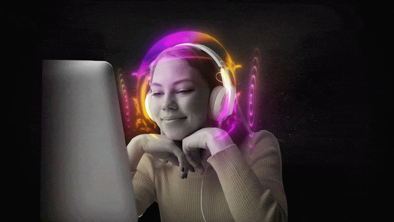 Girl is enjoying the music while watching a computer screen